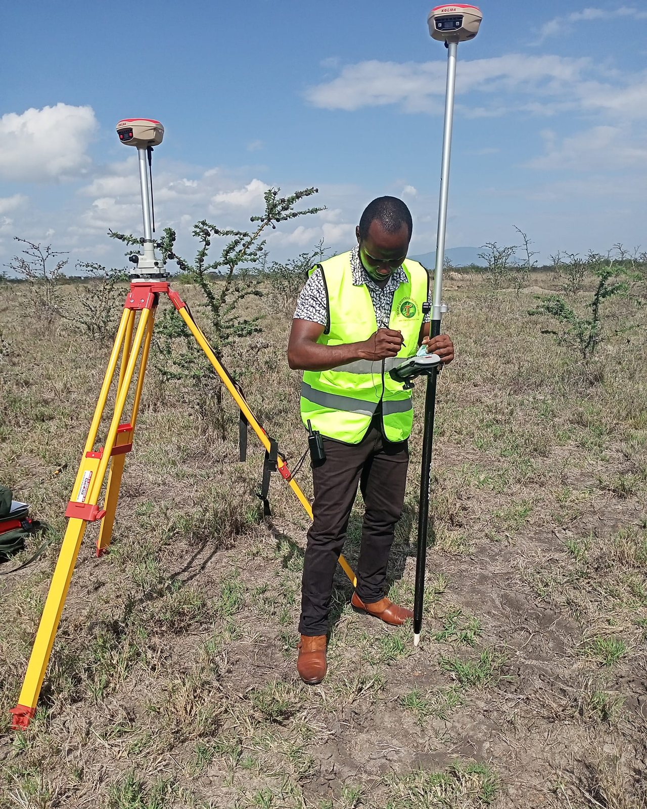 TGL surveyor using GNSS equipment for engineering and setting out work